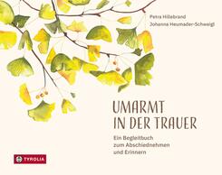 Umarmt in der Trauer