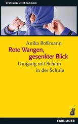 Rote Wangen, gesenkter Blick